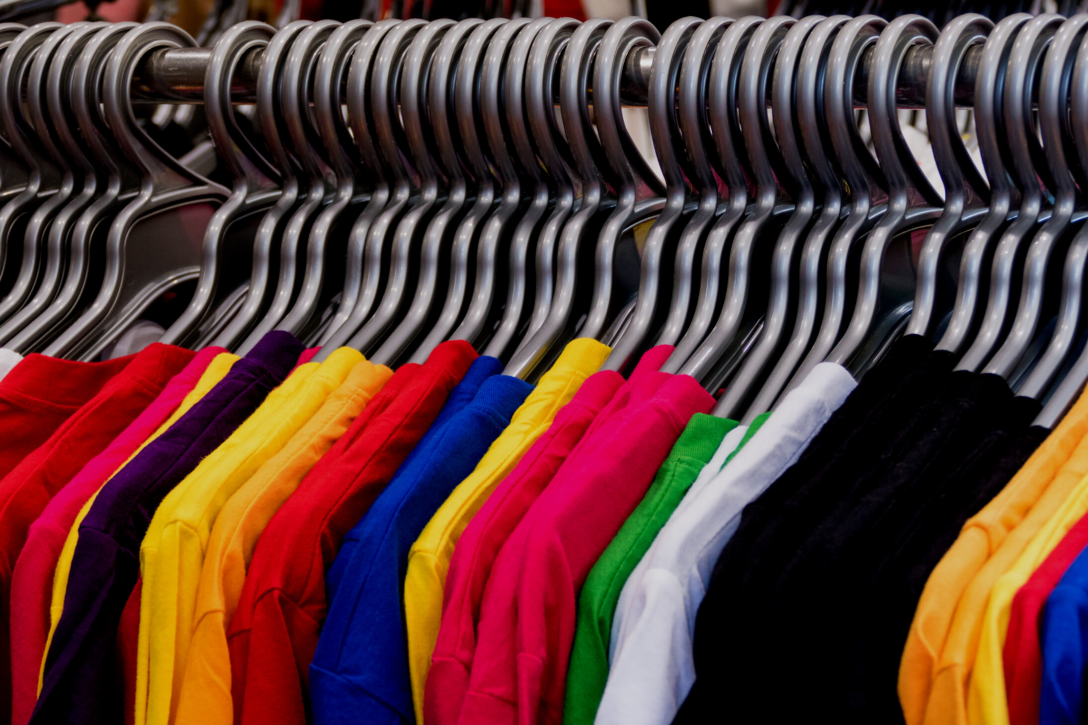 Various Colored T-Shirts on Hangers